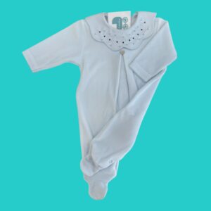 White baby onesie with a lacy Peter Pan collar on a bright teal background, laid flat.