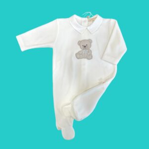 White baby onesie with a teddy bear embroidery on the chest against a teal background.